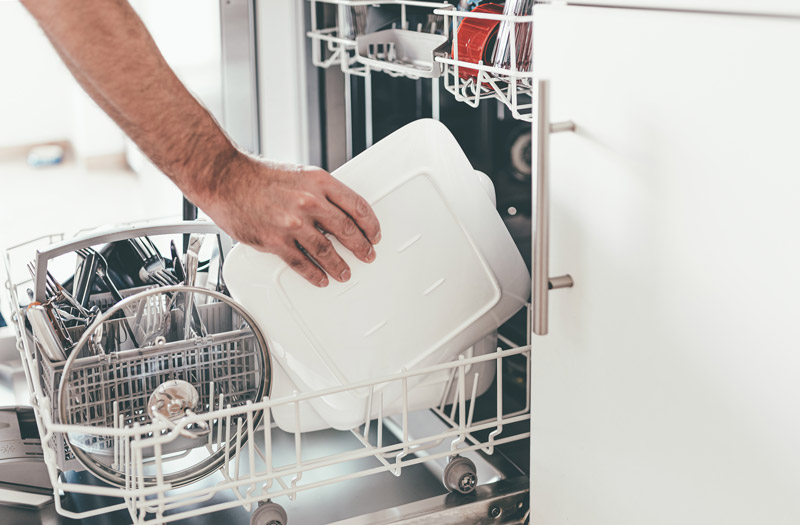 Placing plates in dishwasher rack