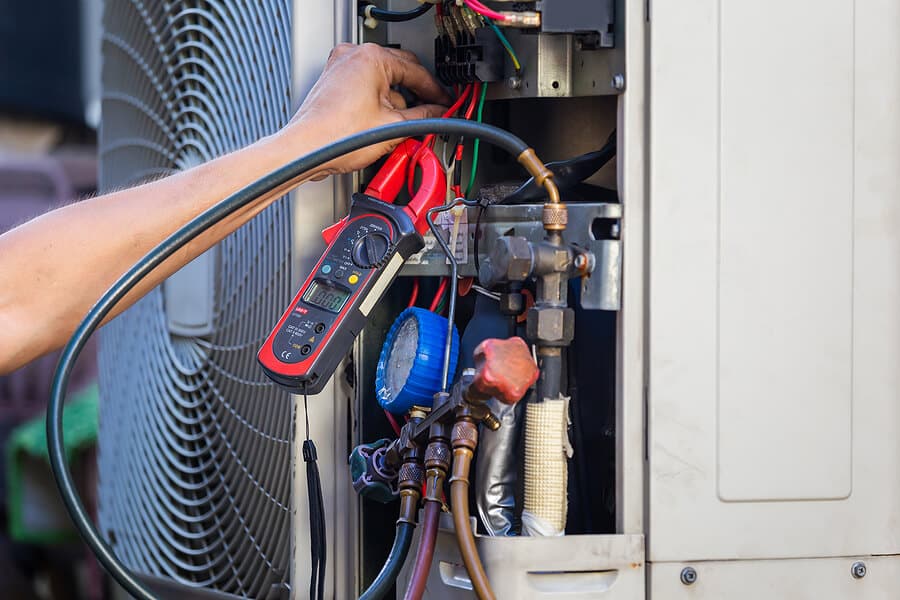 HVAC technician performing professional AC repair service