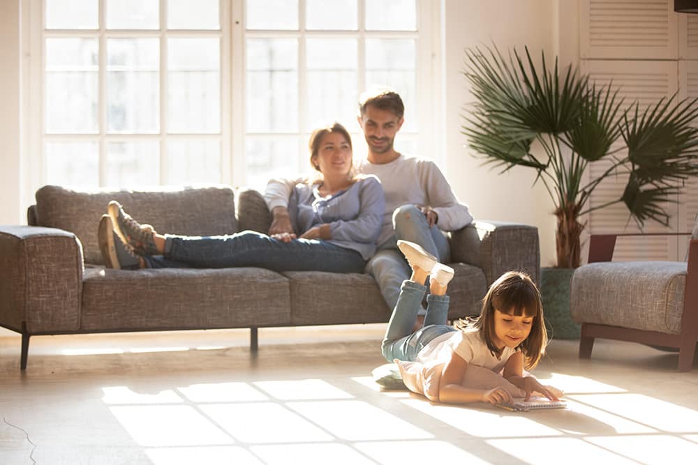 Family relaxing at home with clean air from air purifier