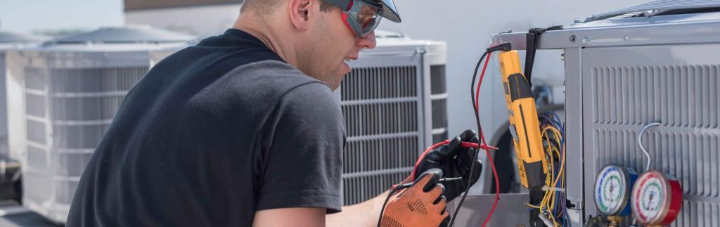 Professional HVAC inspection using diagnostic testing equipment