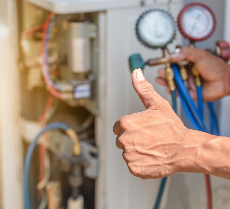 HVAC repair by CW Service Pros checking refrigerant levels