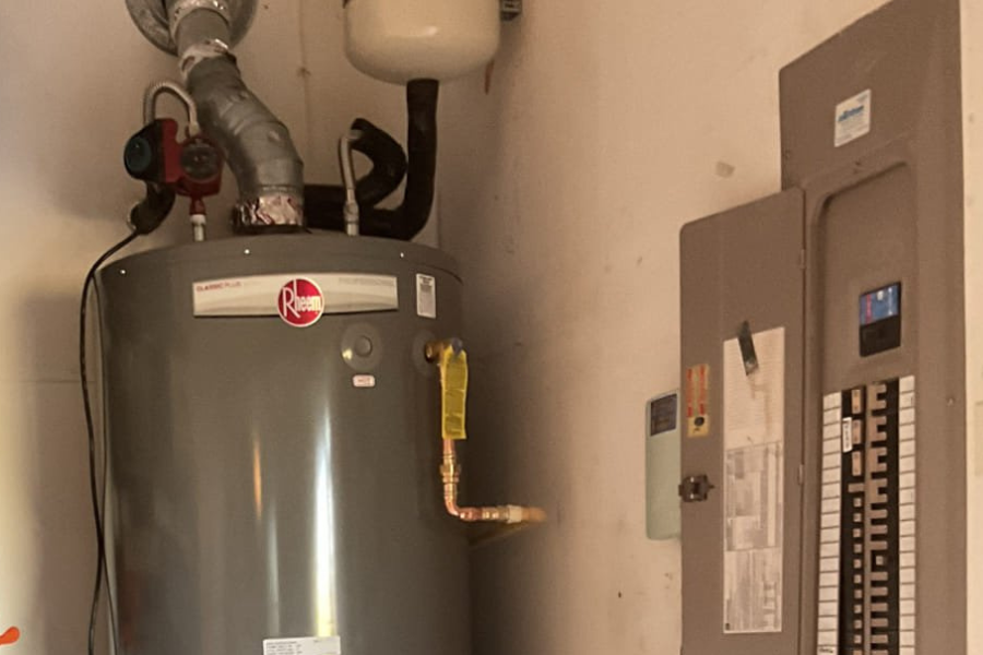 Expert gas water heater installed by a CW Service Pro with Grundfos Recirculation System and Expansion Tank in garage
