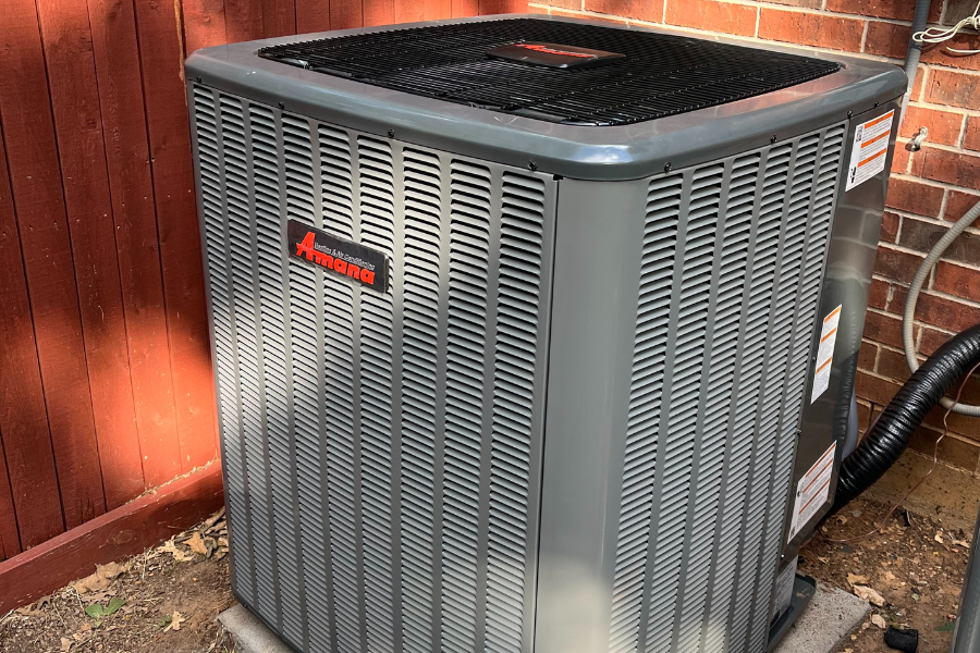 Newly installed Amana outdoor AC compressor unit by CW Service Pros for a home in Dallas, TX.