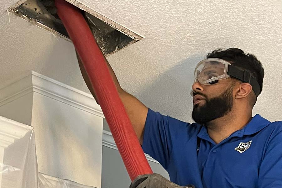 CW Service Pros technician performing HVAC duct repair