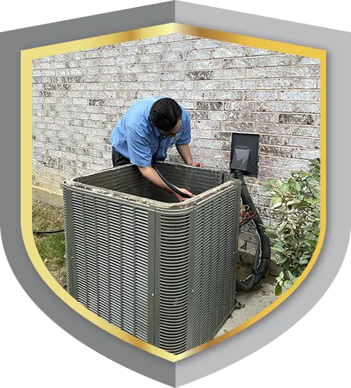 AC tech servicing outdoor condenser unit