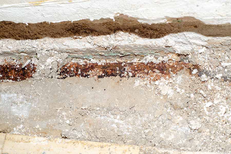 Exposed pipe showing slab leak damage in Lewisville, TX