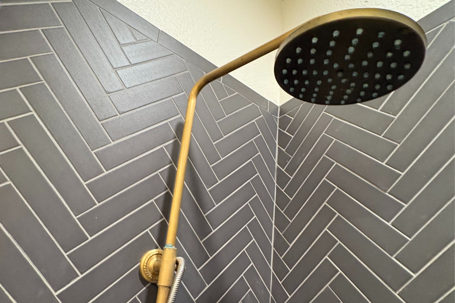 Plumber repaired homeowner's gold rain shower head