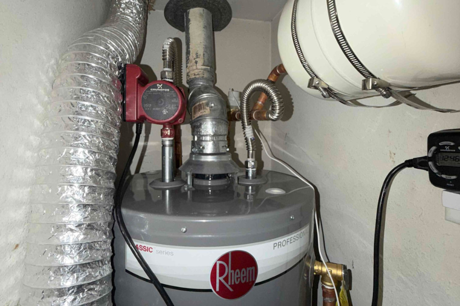 CW Service Pros plumber installing a high-efficiency water heater in a Flower Mound, TX home.