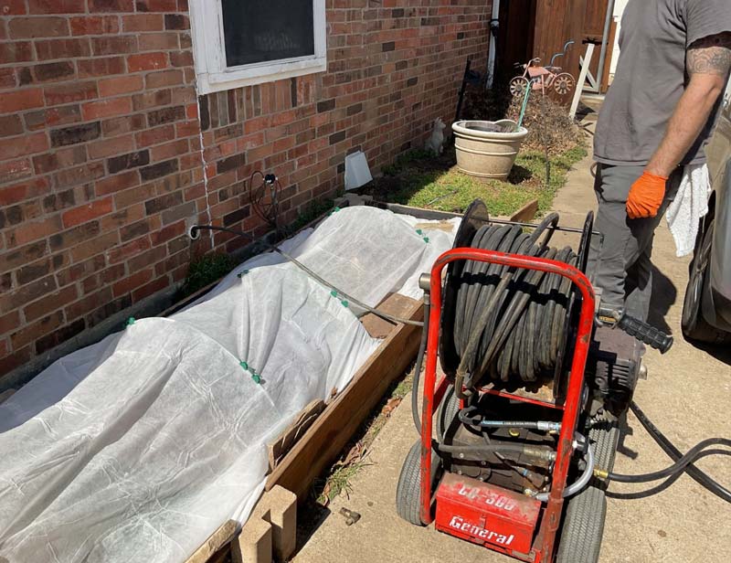 Hydro jetting service setup in residential backyard in Lewisville TX