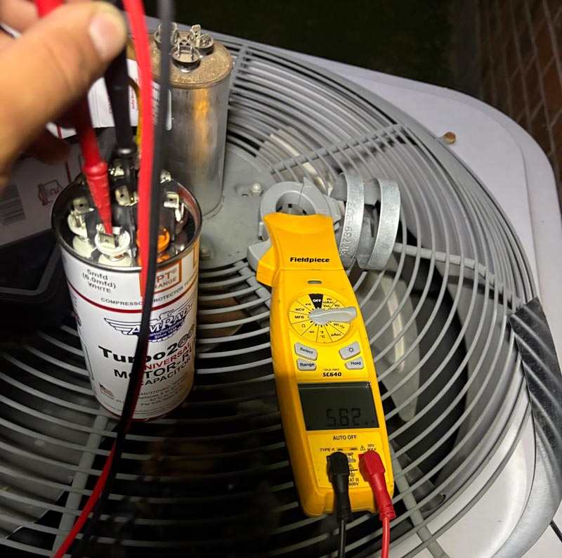 Residential AC repair in Flower Mound TX inspecting condenser wiring