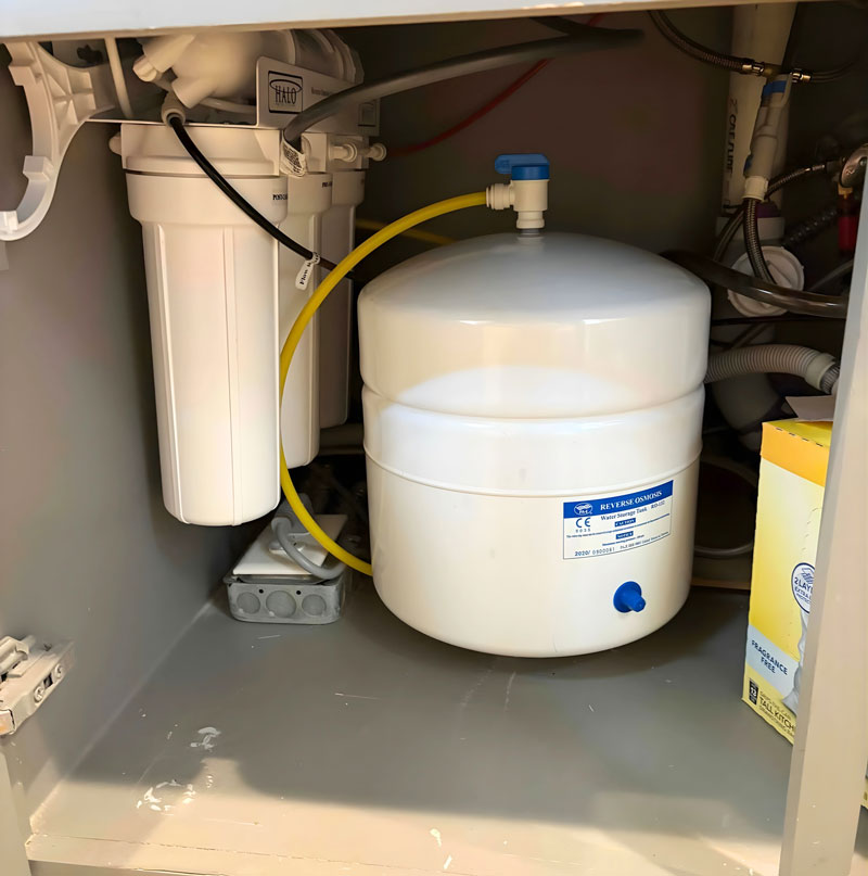 CW Service Pros water filtration installation under kitchen sink in Lewisville TX