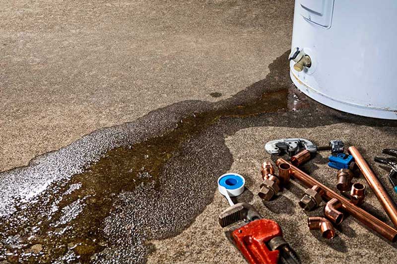 Water heater leak causing water damage on the floor in Flower Mound TX